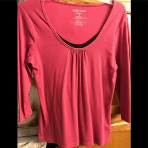 Knit pink with black peeking out top